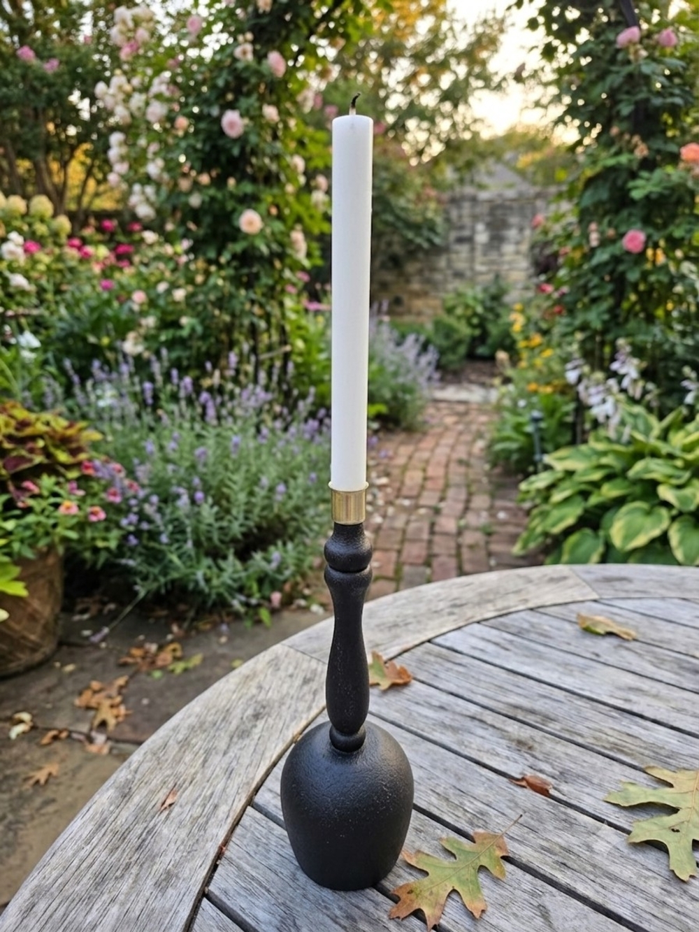Black and gold taper candlestick holder Bulbous base Sleek turned spindle neck